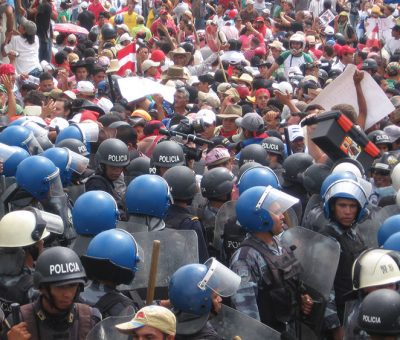 A group of people standing in front of a crowd