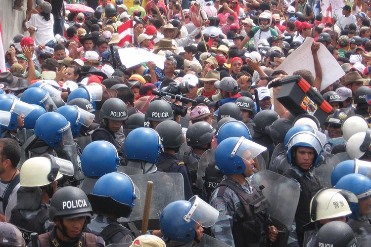 A group of people standing in front of a crowd