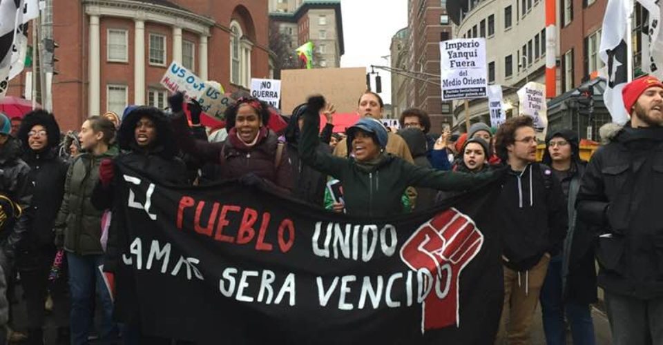 A group of people standing in front of a building