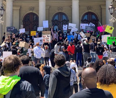A group of people standing in front of a crowd