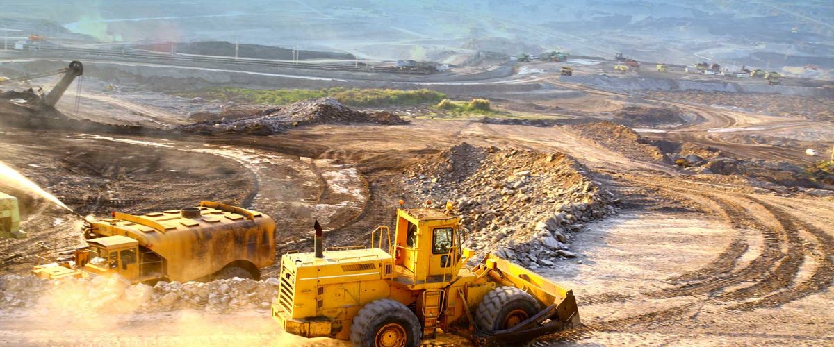 A truck driving down a dirt road