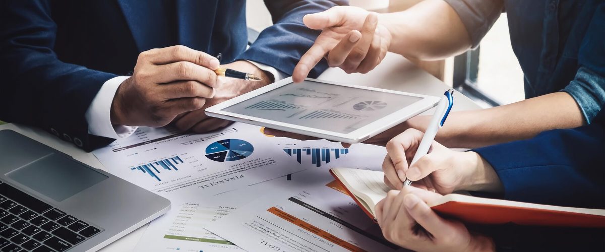 A person sitting at a table using a laptop