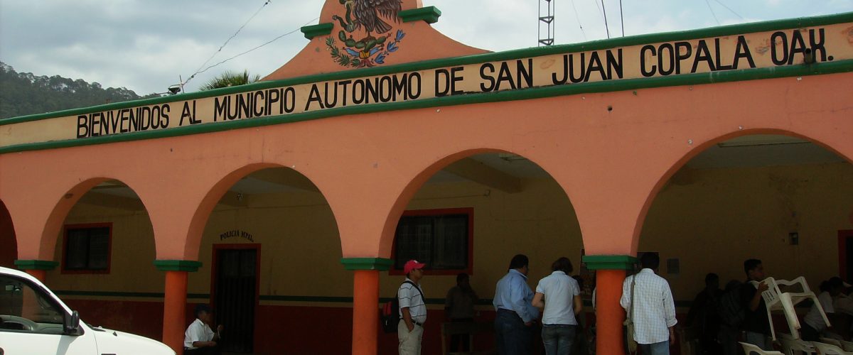 A group of people standing in front of a building